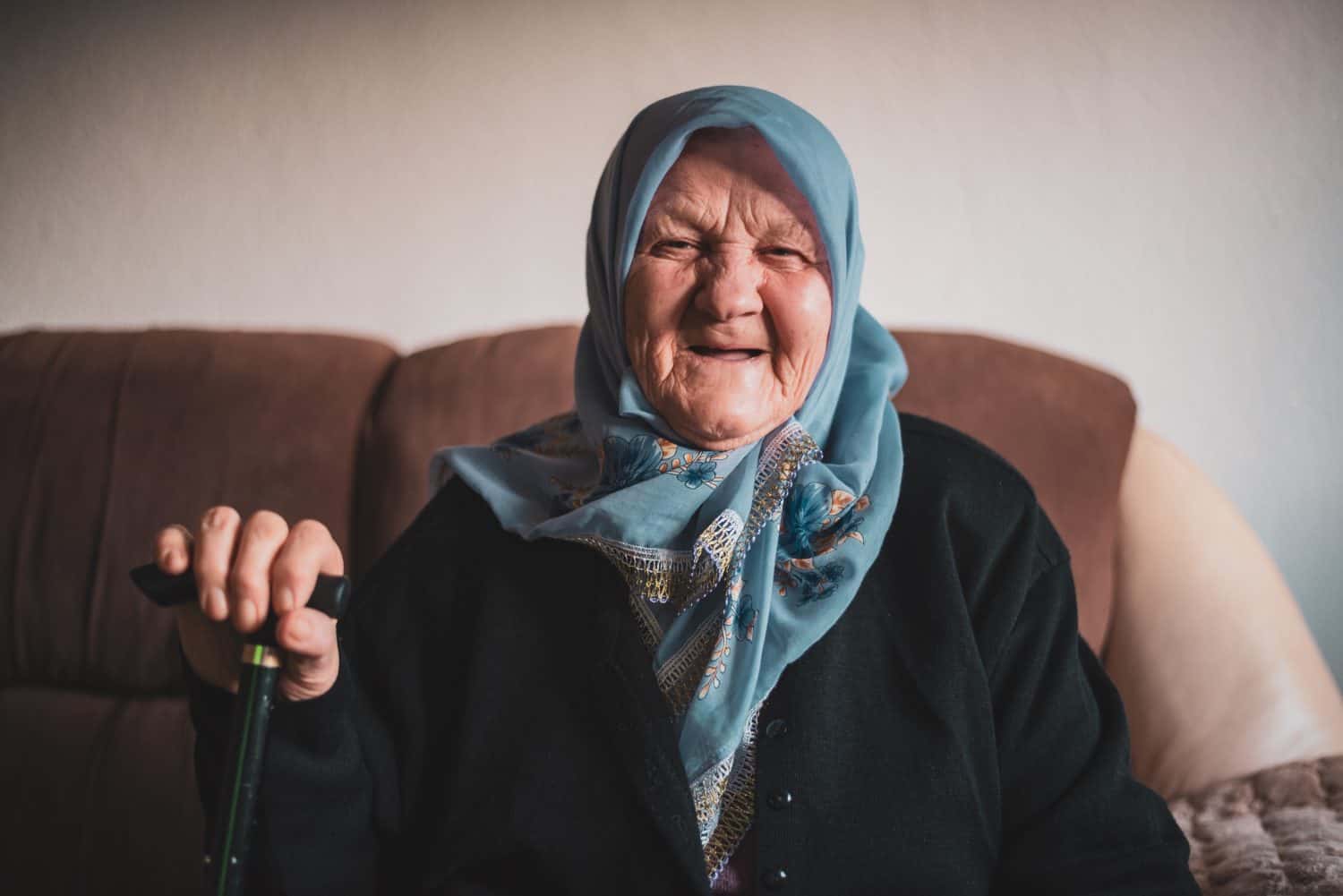 Beautiful face portrait of a happy Muslim grandmother in hijab. . High quality photo