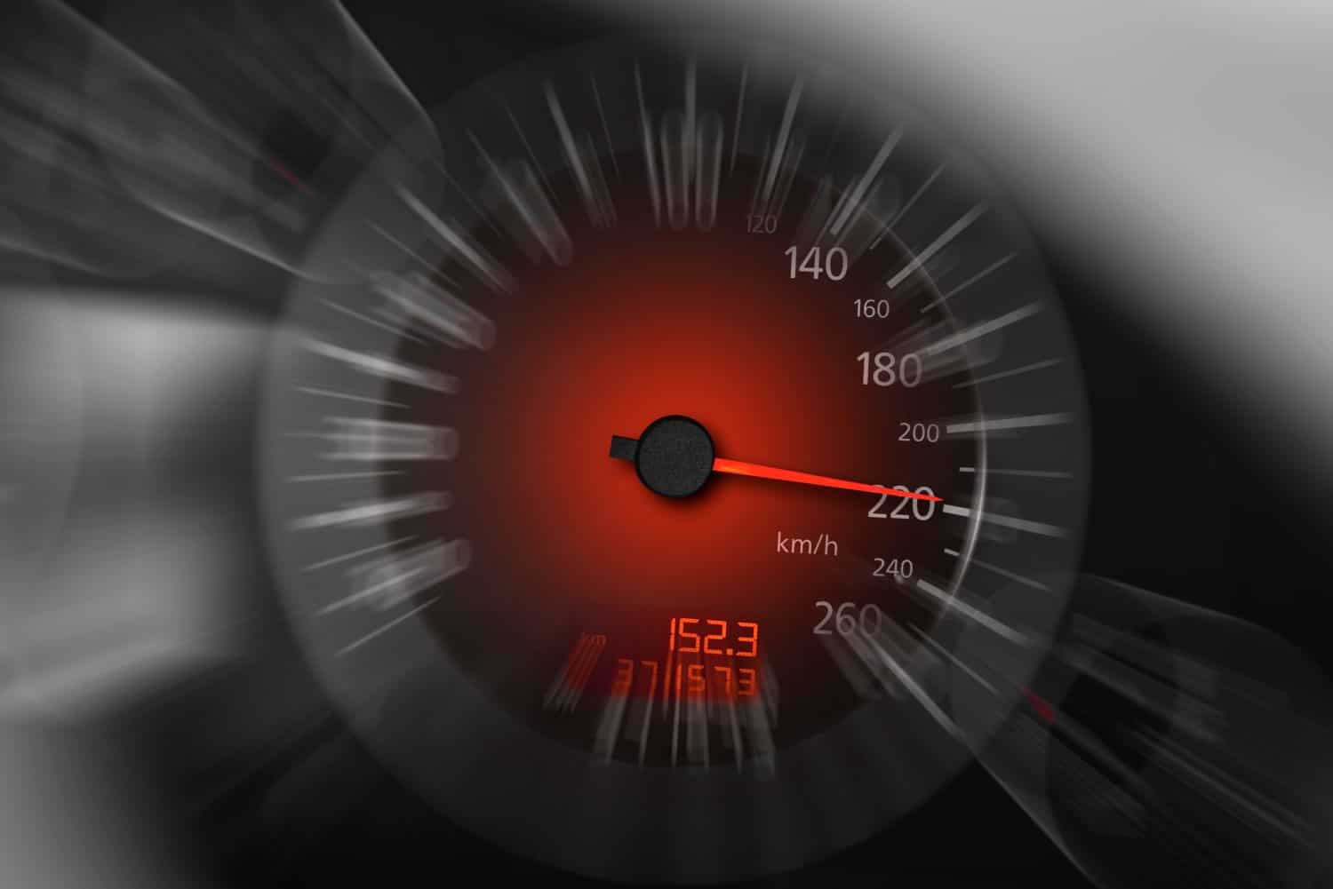 Car speedometer. High speed on a car speedometer and motion blur.