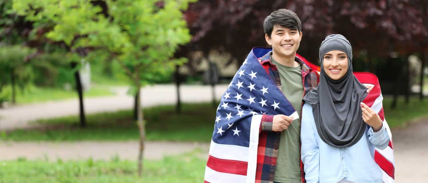 Young people with USA flag in park