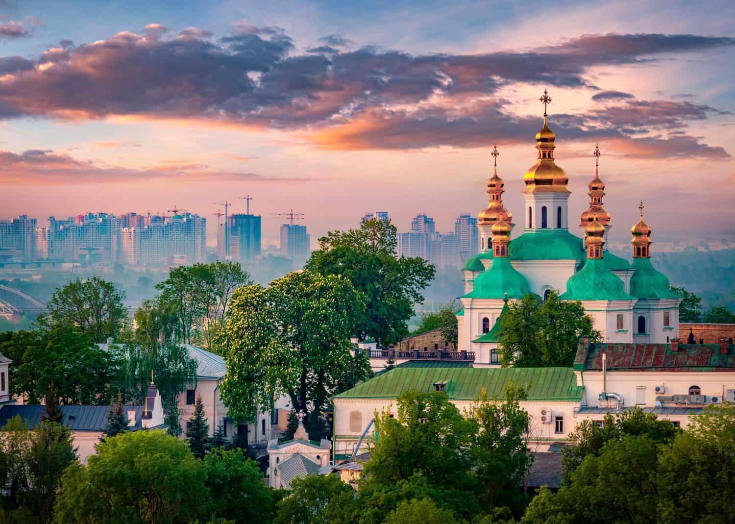 Amazing summer sunrise of Kiev Pechersk Lavra Orthodox Monastery. Impressive morning view of Kiev, capital of Ukraine, Europe. Traveling concept background.