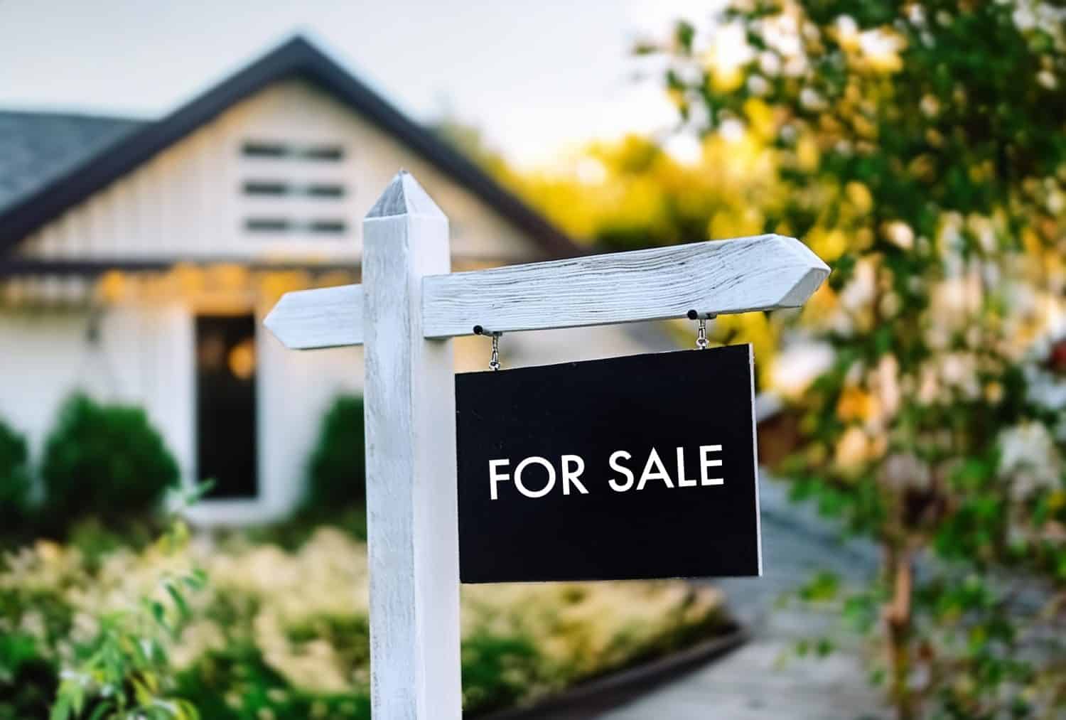 Close-up of for sale sign in font of house, real estate sign, open house, American real estate, USA