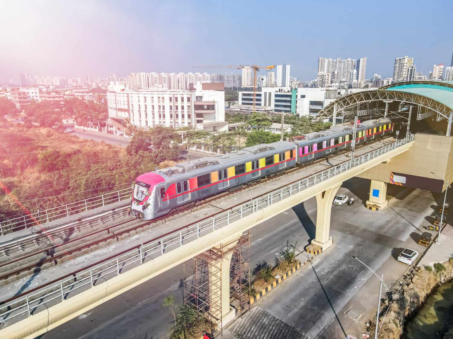 Navi Mumbai, India, 2024. Aerial shot of metro tracks in urban areas of navi Mumbai, taloja, kharghar with metro running on the tracks. A very useful addition to existing MAHA METRO rail network