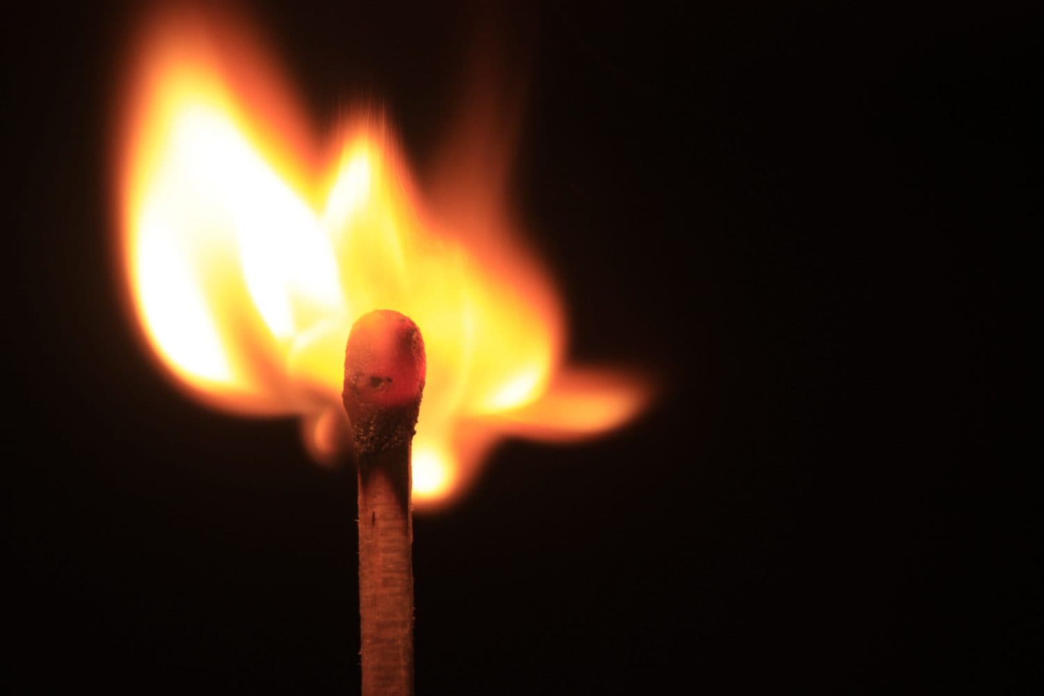 burning matches on a black background