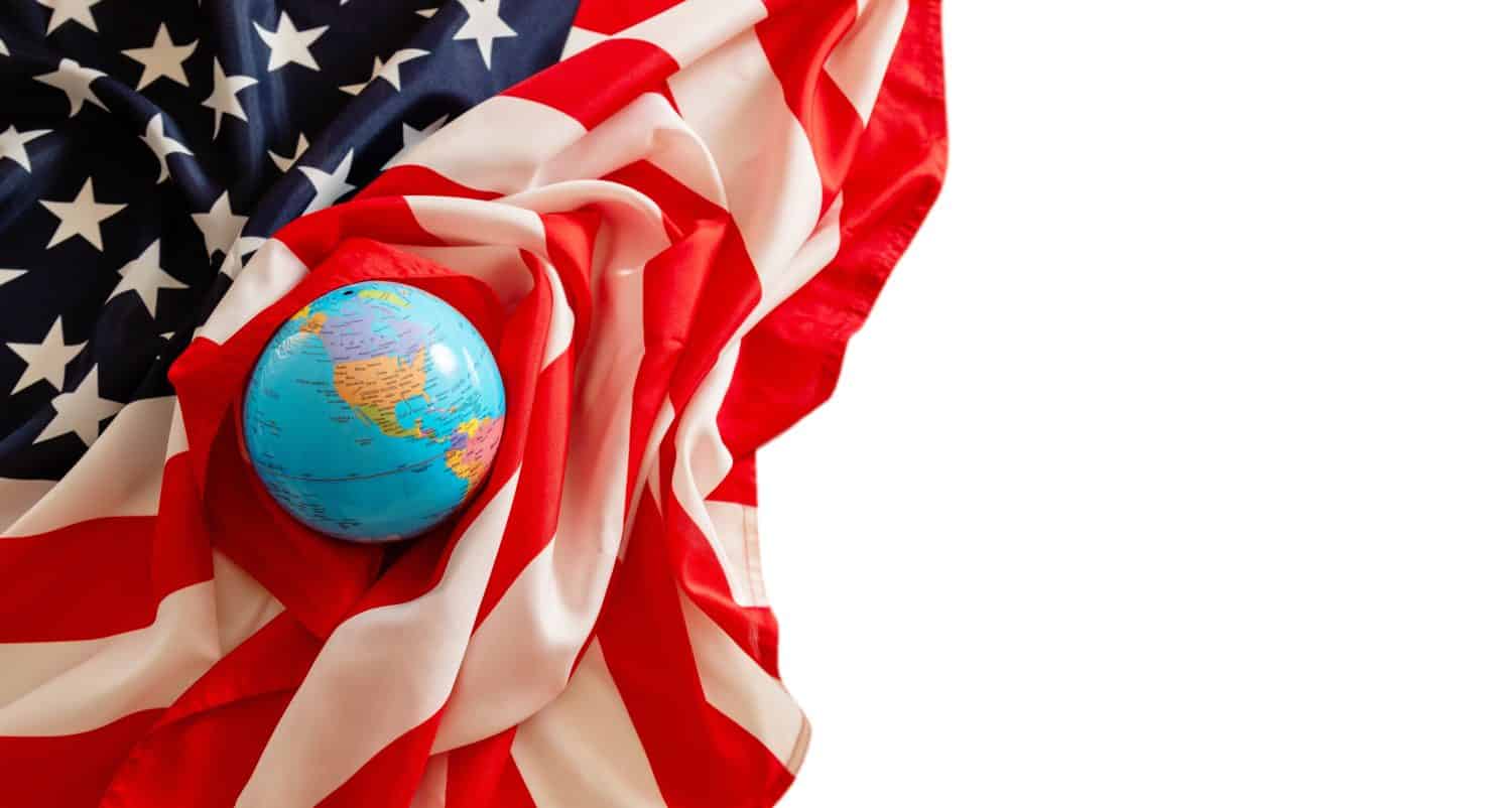 Globe of the world lies with the flag of the USA. American flag. Free space for inserting information.