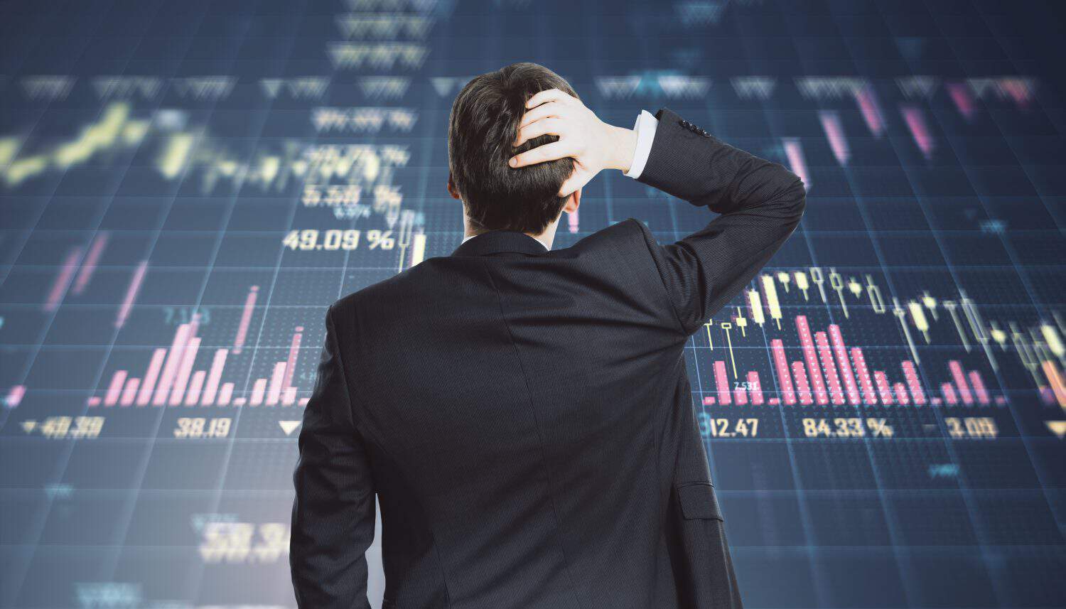 Back view of stressed young european businessman with glowing falling forex chart on blurry background. Economic recession, crisis and trade concept. Double exposure