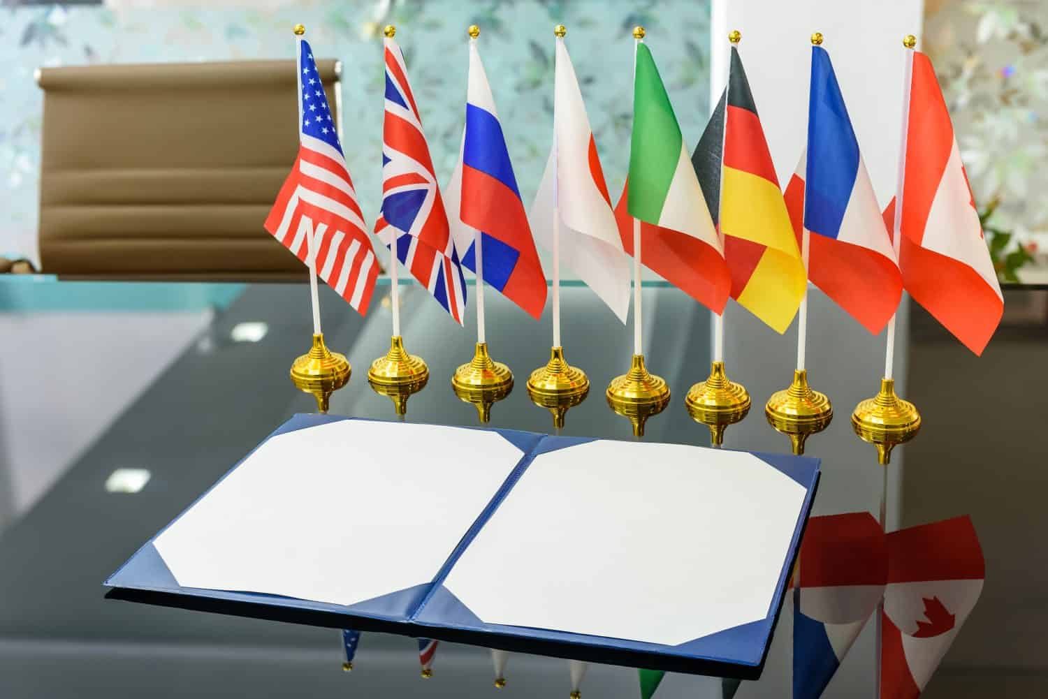 Multilateral trade and military agreement signing concept : National flags of G8 or group of eight major highly industrialized countries i.e Canada, France, Germany, Italy, Japan, Russia, UK, USA