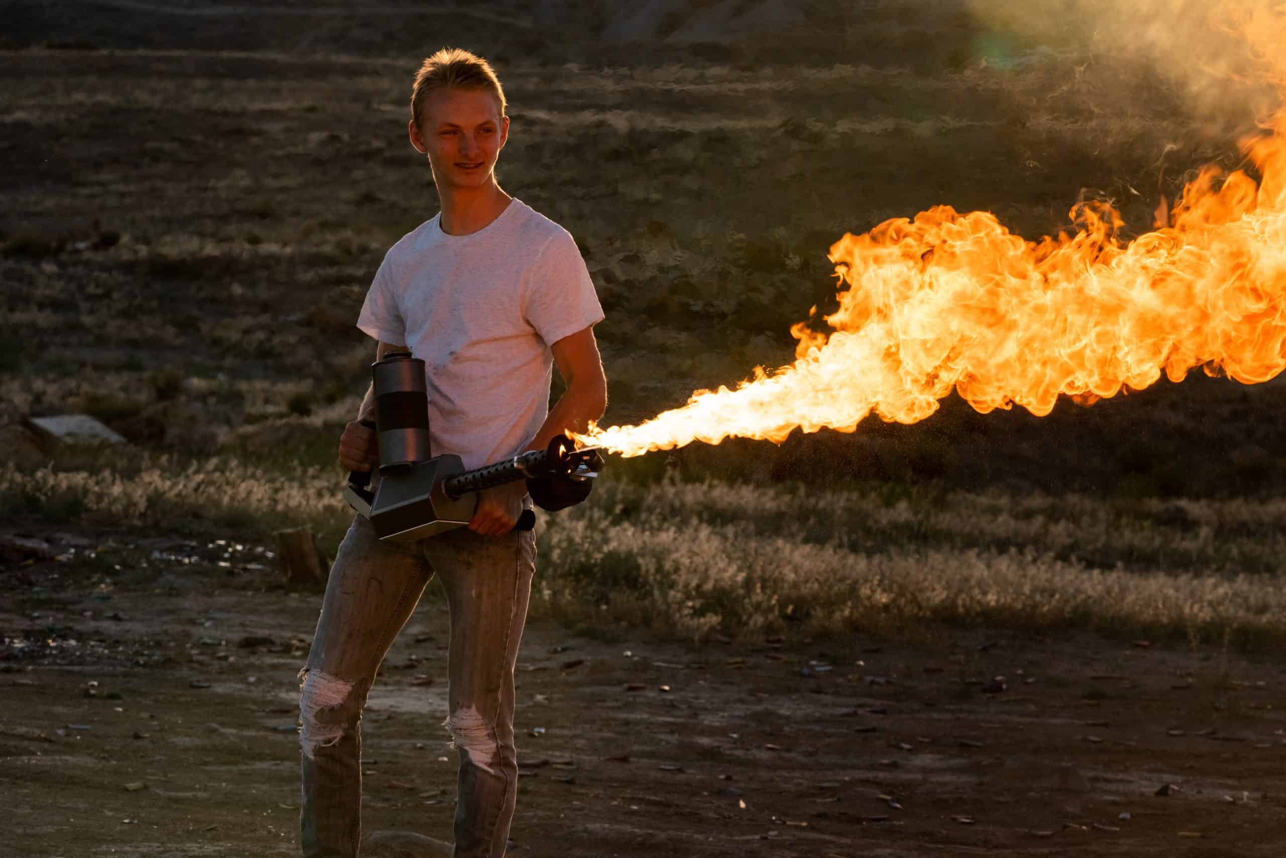Young Man Operating a Flamethrower