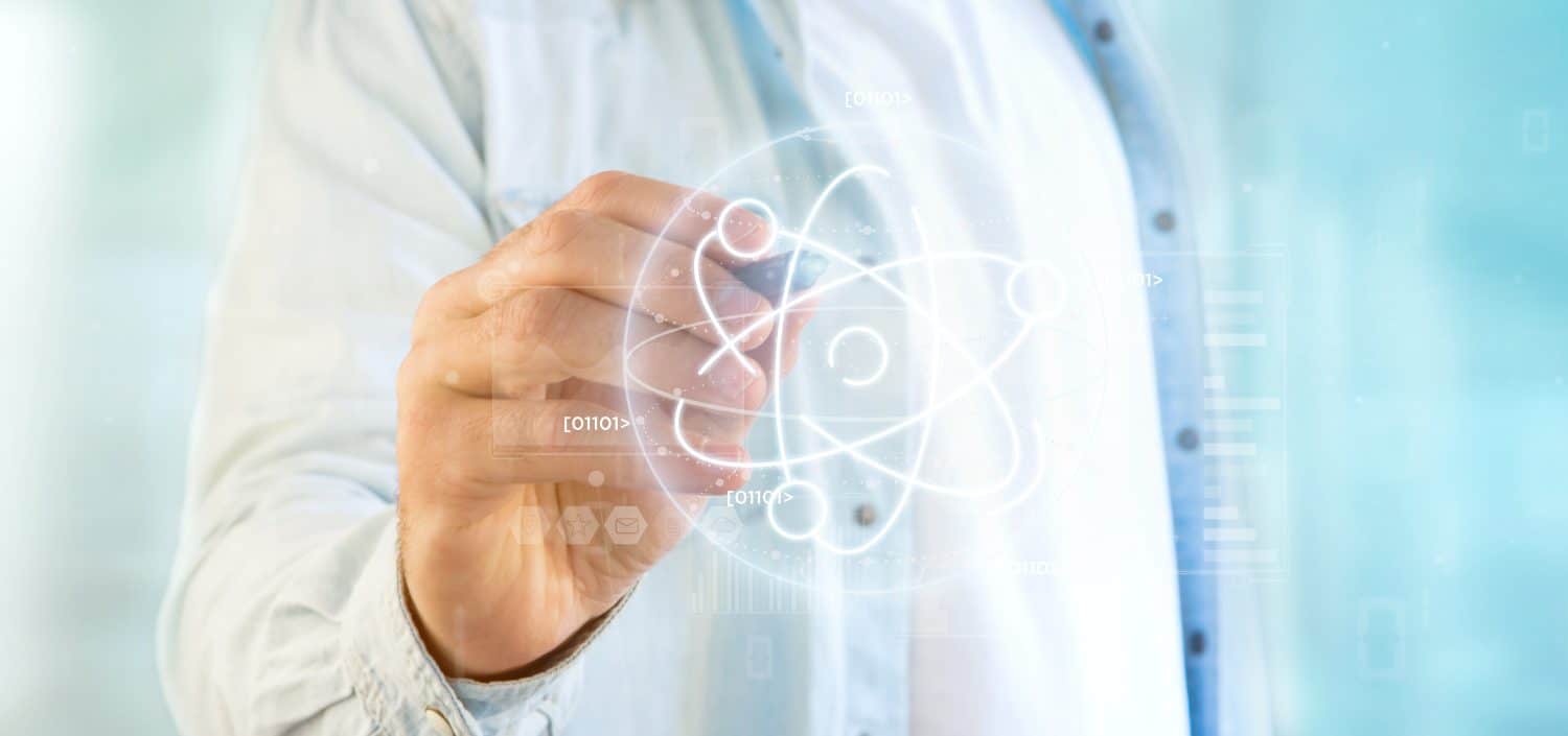 View of a Businessman holding an atom icon surrounded by data