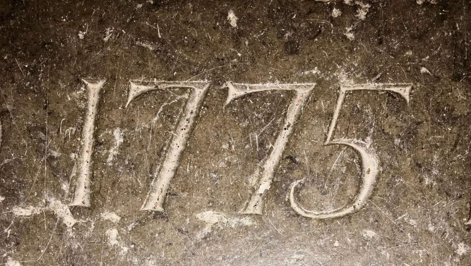 &quot;1775&quot; carved in stone – a detail of an inscription produced that year