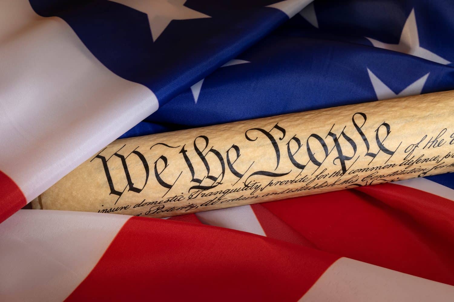 American flag blended with the United States Constitution for use as a symbol of laws, freedom and separation of government powers.