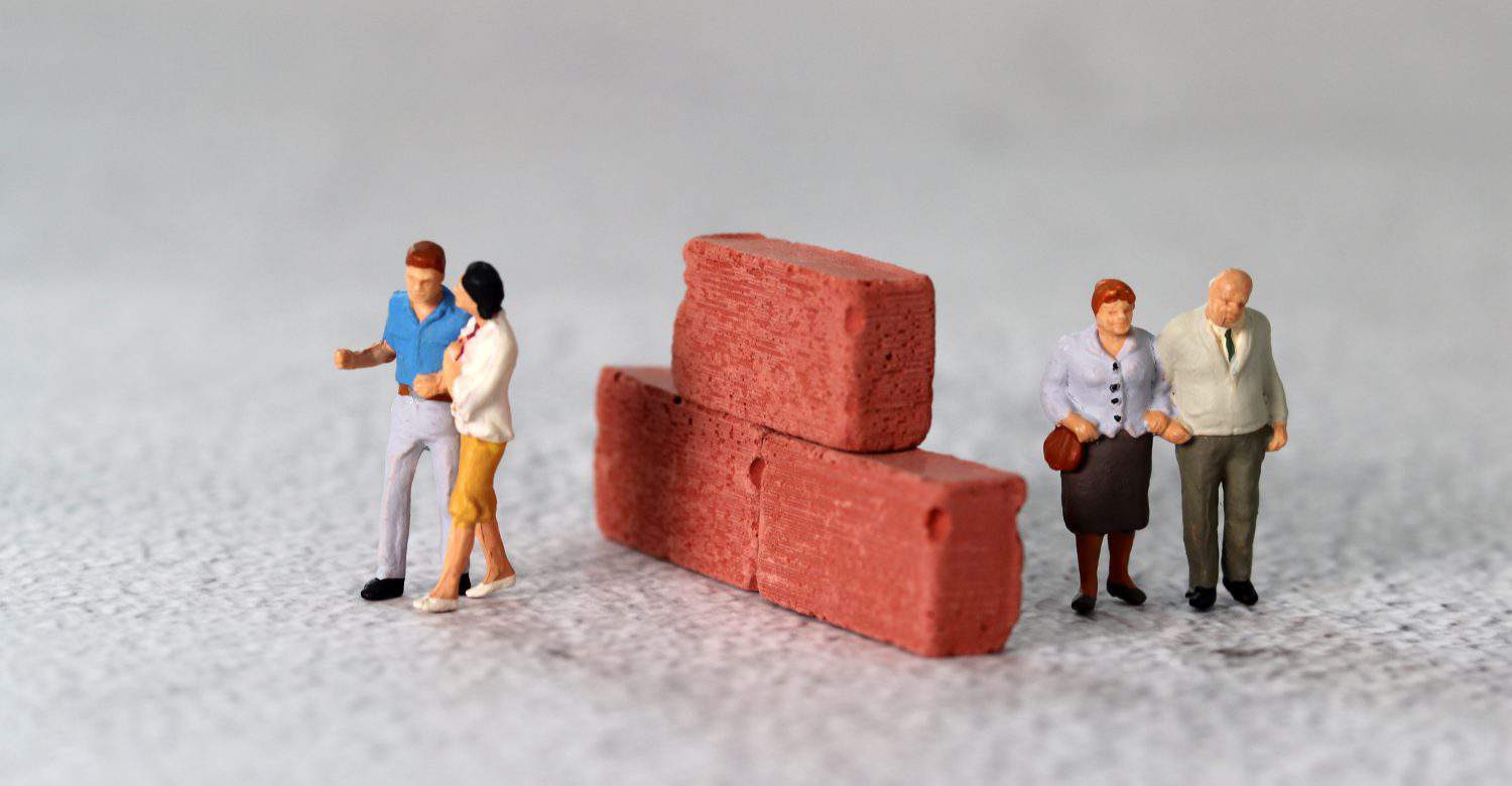 Red bricks and miniature people. The concept of generational feud.