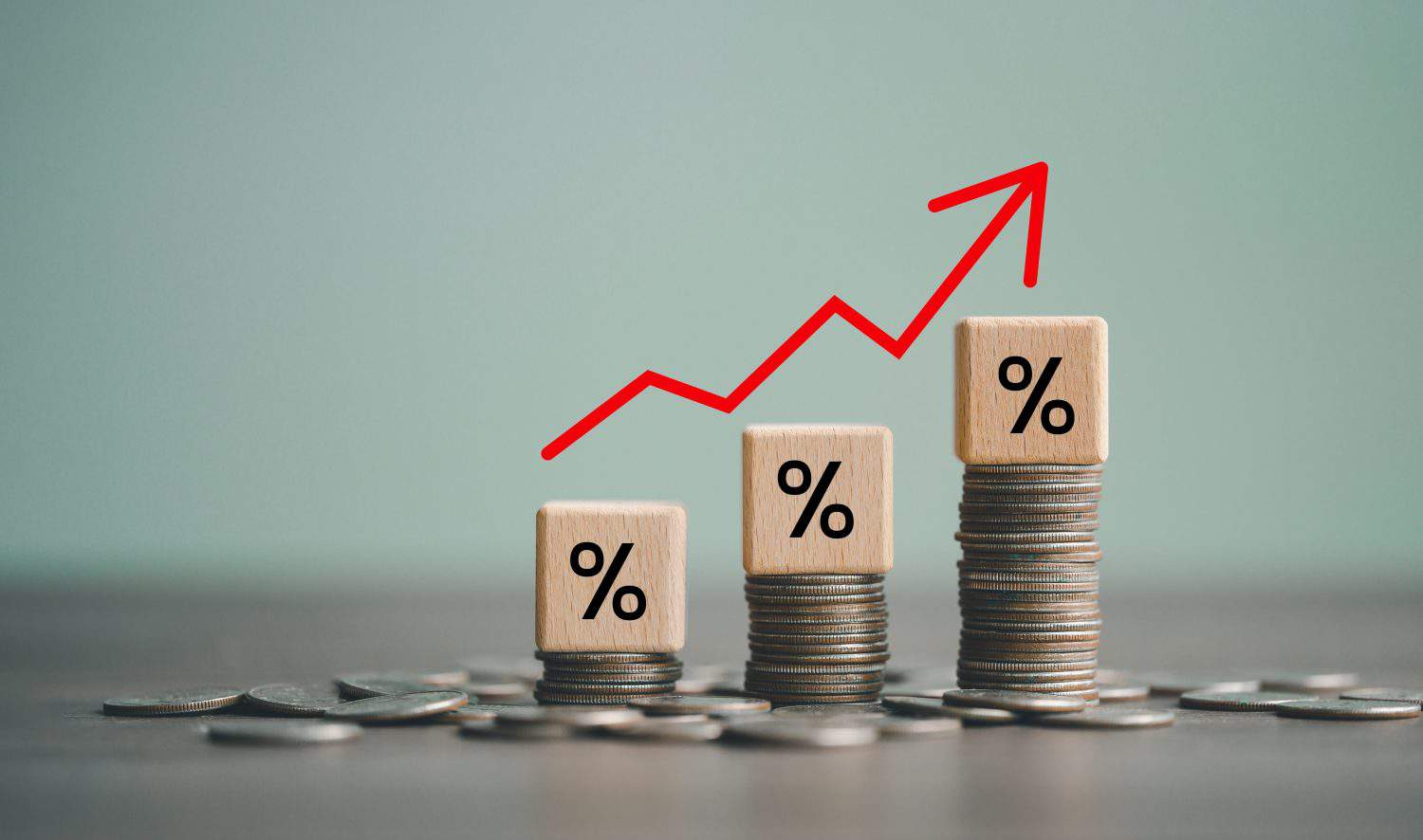 inflation concept, red graph arrow, Percent sign on a wooden cube with row of coins in idea for FED consider interest rate hike, world economics, and inflation control, US dollar inflation.