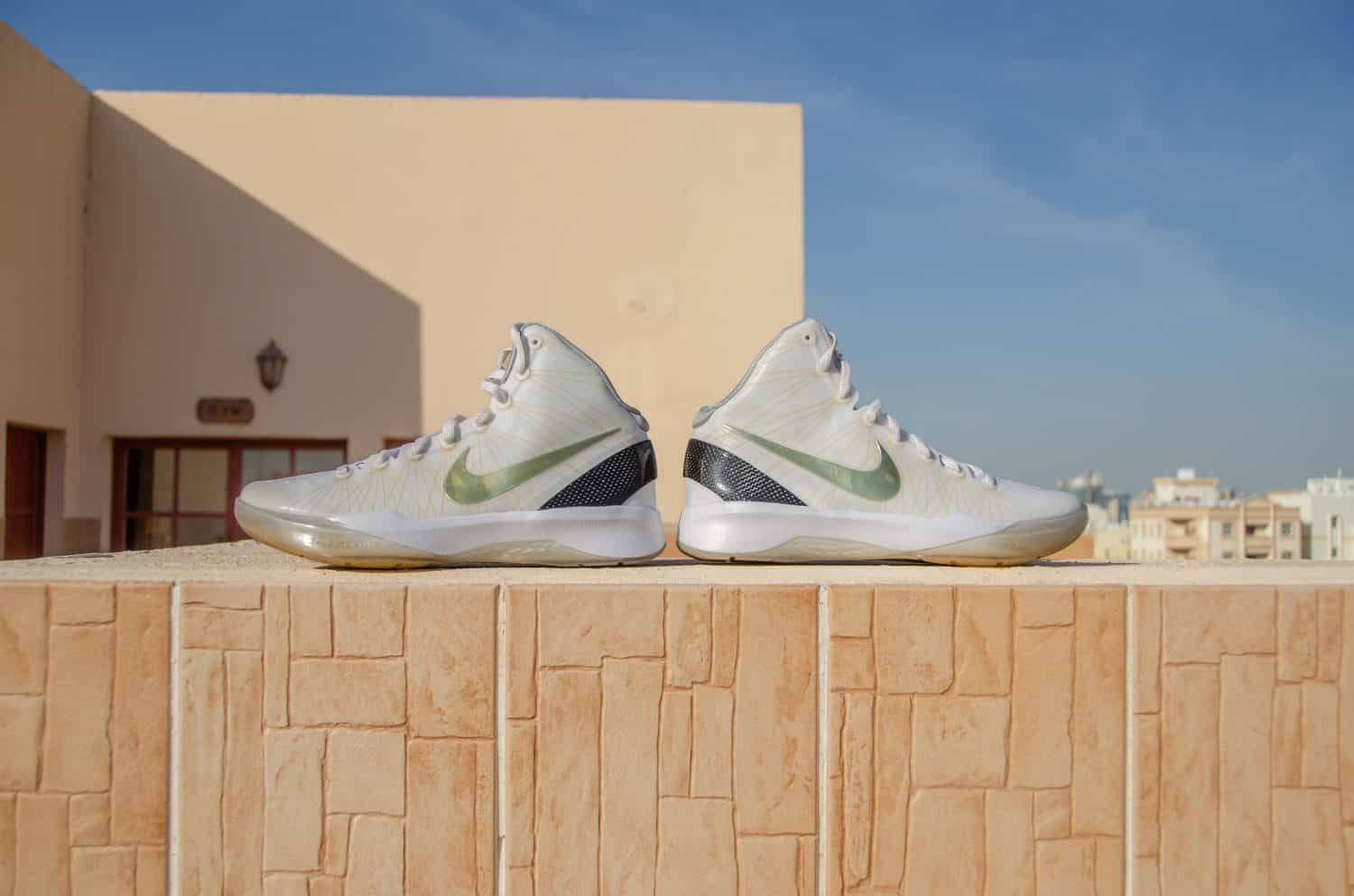 Doha, Qatar - January 1, 2017: A detailed pictue of Nike Hyperdunk Elite. A rare pair showing carbon fiber, gold and white colorway basketball shoes in VNDS condition.