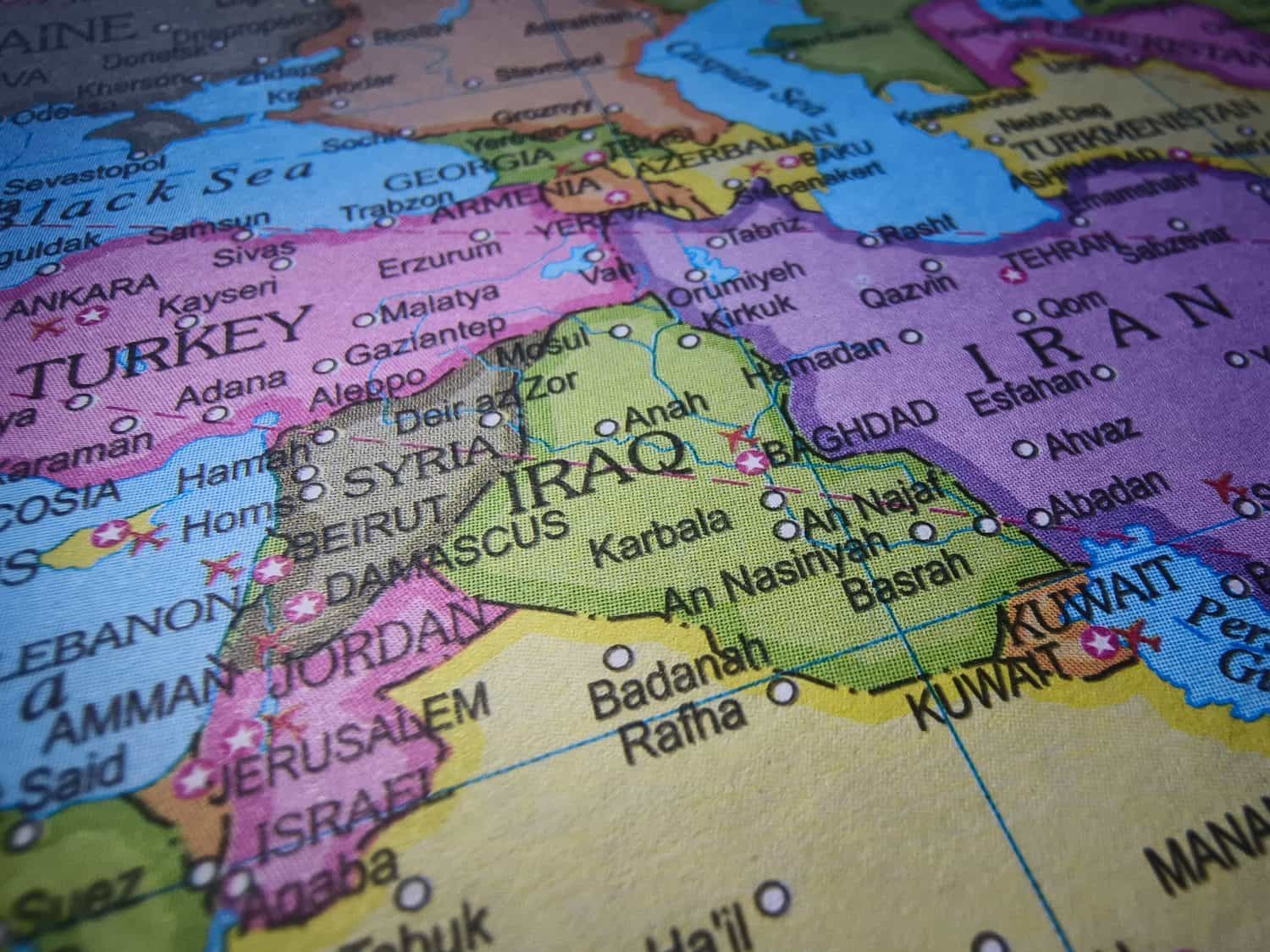 Closeup of Iraq in sharp focus on world map.