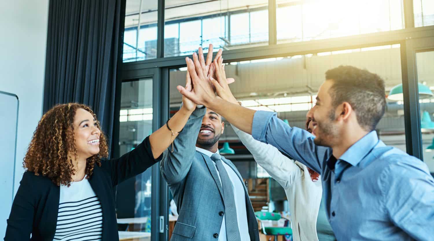 People, high five and diversity in workplace for business meeting, collaboration or partnership. Office team, support and success together for agreement, achievement and connection in New York