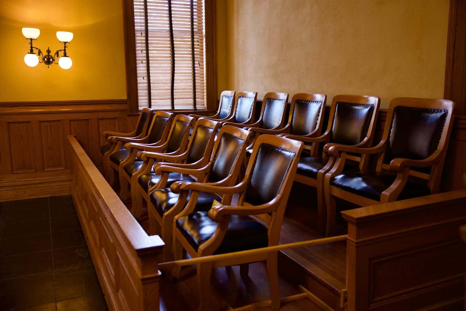 Old fashioned jury box with twelve matching armchairs