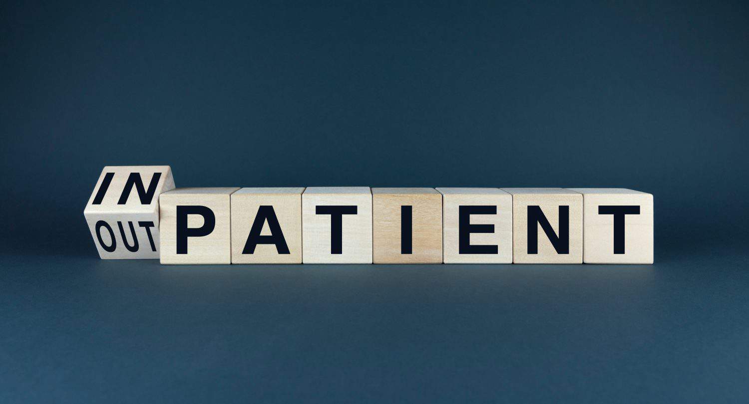 A conceptual image representing the divide between inpatient and outpatient care