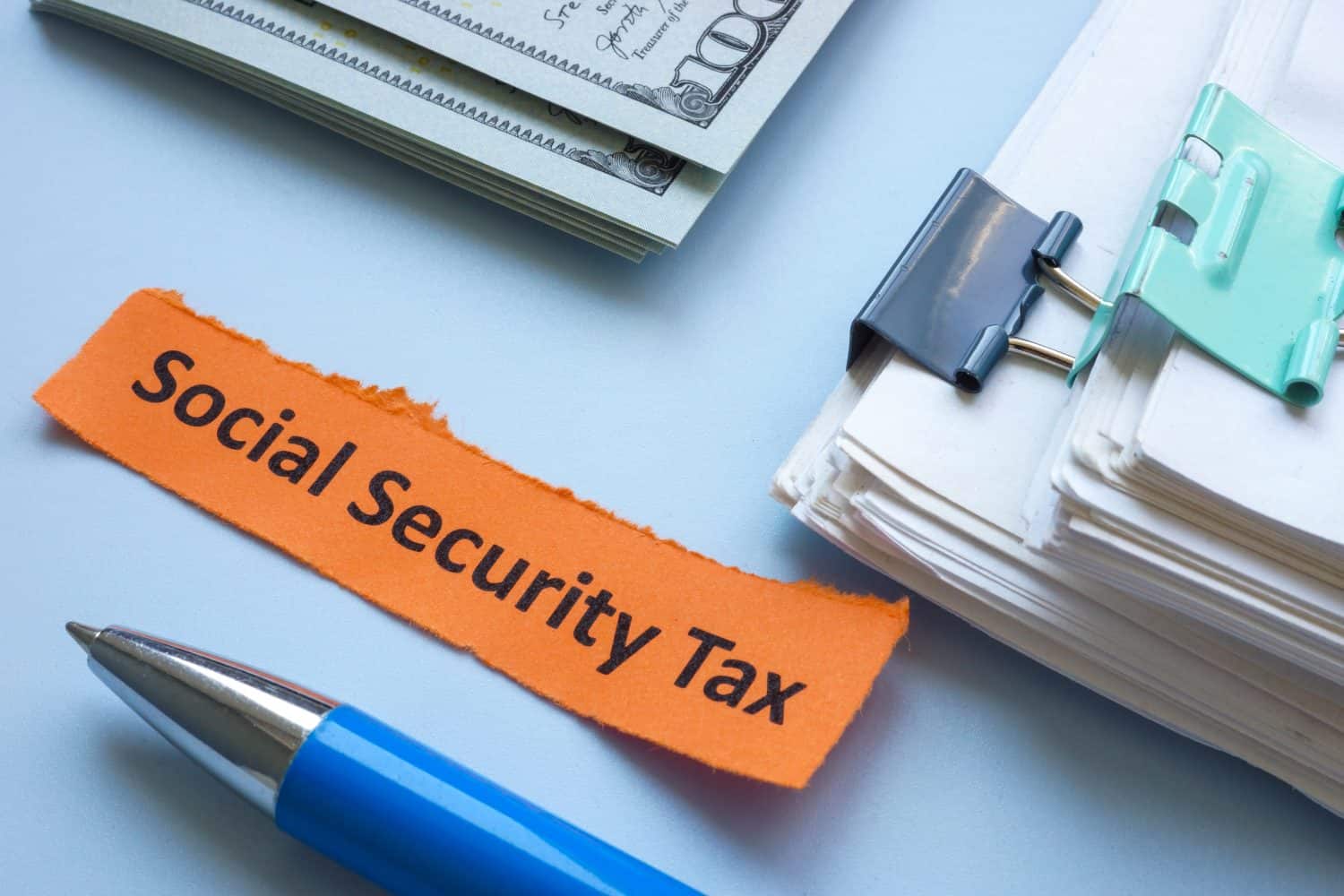 A stack of papers with the label social security tax.