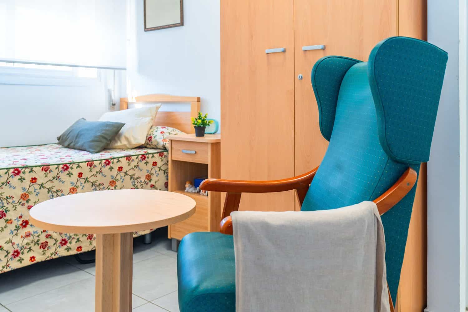 Empty private room of a nursing home with furniture and accessories and no people