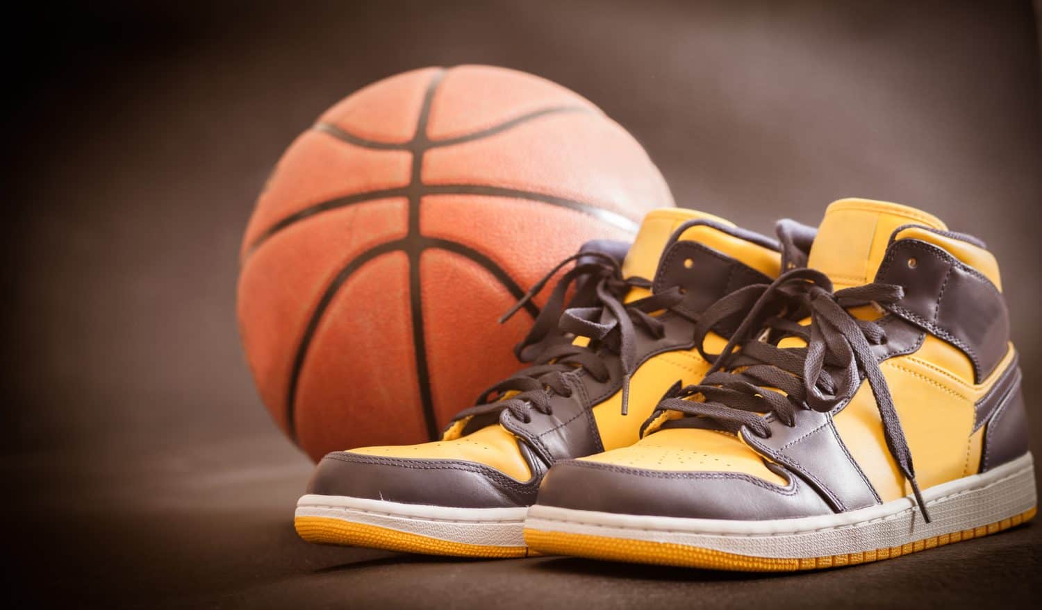 Basketball court with ball and shoes