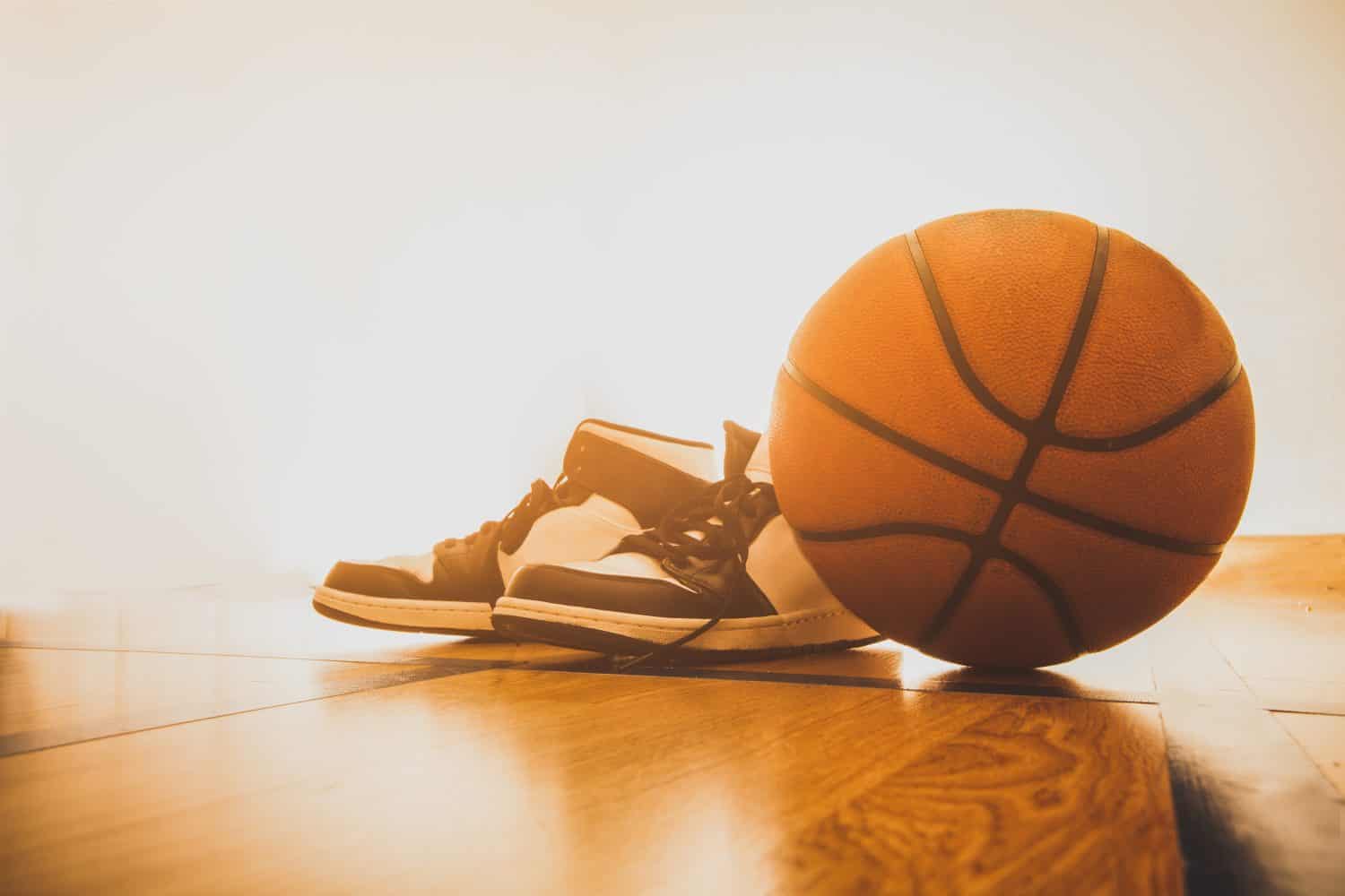 Basketball court with ball and shoes