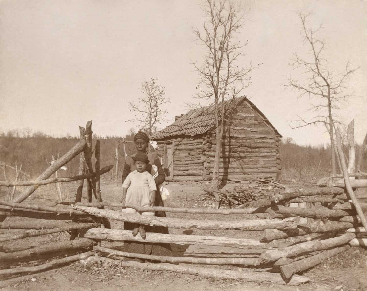 African American-Creek woman and child at their Southern homestead, ca. 1910-1930.