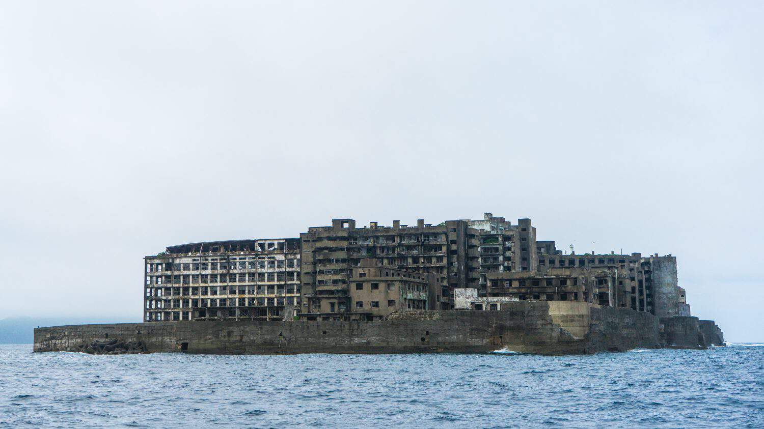 Hashima Island in Nagasaki, Japan. Also called Battleship Island. A symbol of the rapid industrialization of Japan. It is a UNESCO World Heritage site.