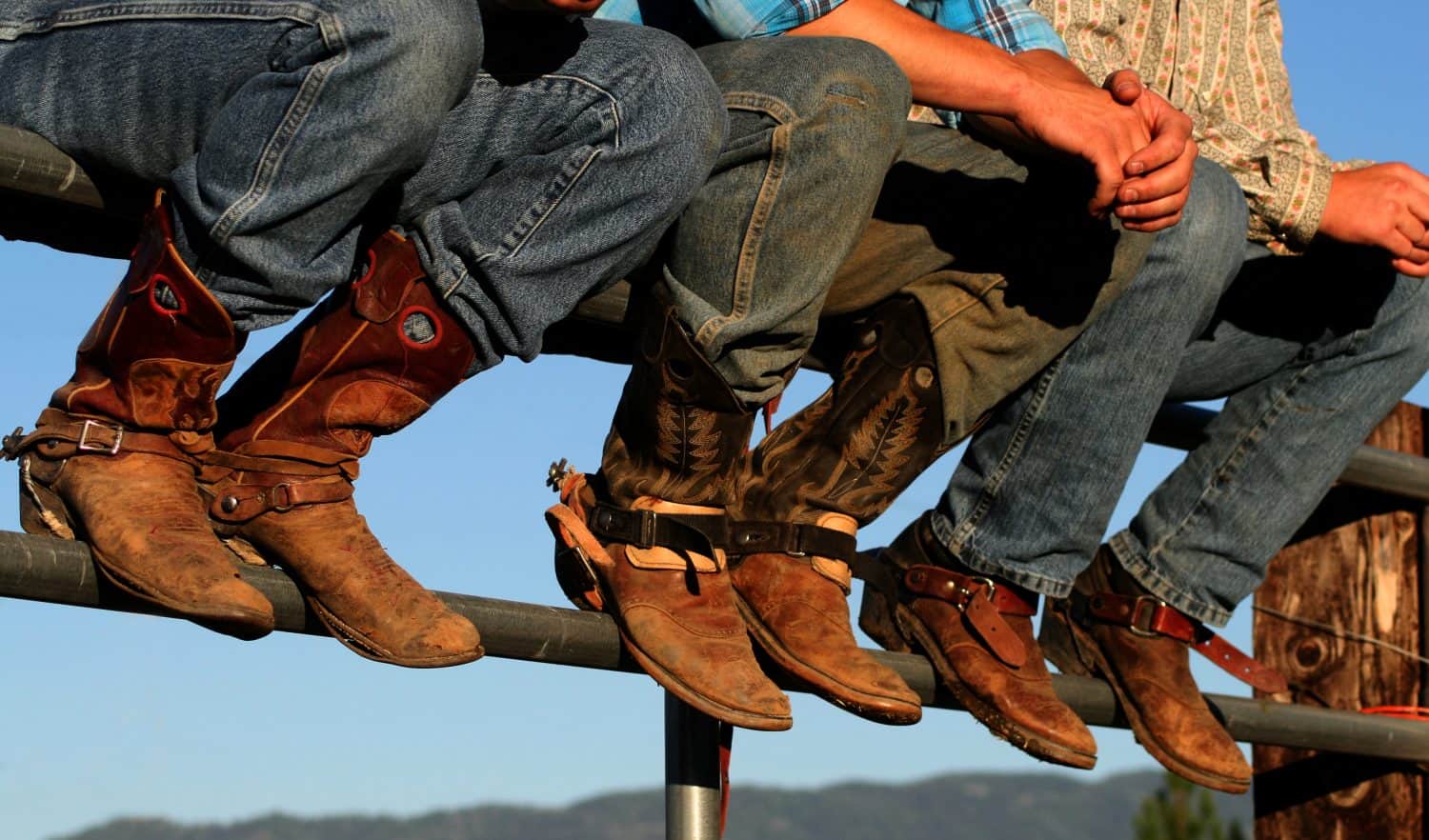 Well worn boots adorn the wranglers at rodeo in small county fair, Idaho