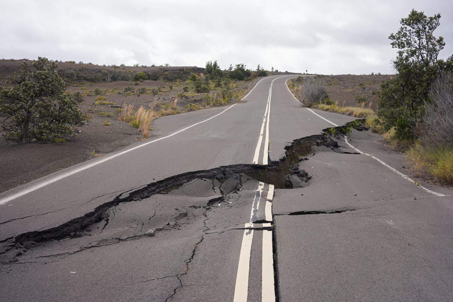 Asphalt road damaged by the volcanic eruption of Kīlauea and caldera collapse with subsequent earthquakes in Hawaii Volcanoes National Park on the Big Island.