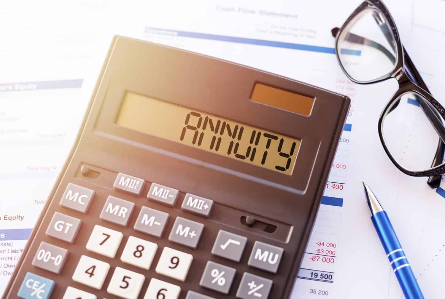 Annuity Concept Displayed on Calculator With Financial Documents in Office Setting