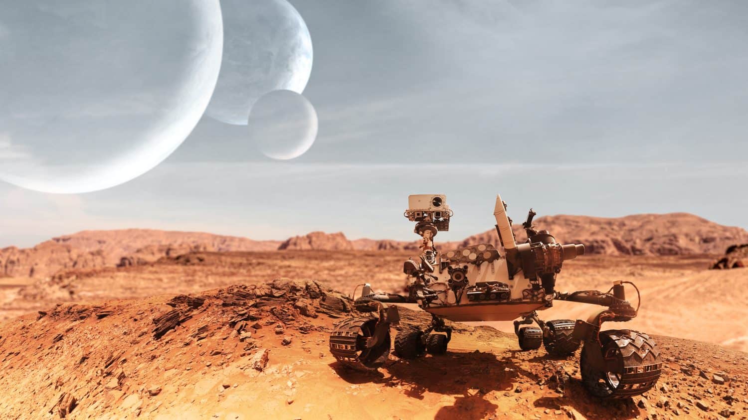 Curiosity Mars Rover exploring the surface of red planet. Elements of this image furnished by NASA.