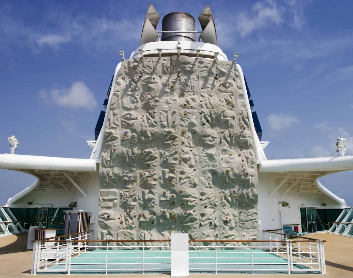 A recreational climbing wall located on the aft side of the main smokestack on board a cruise ship.