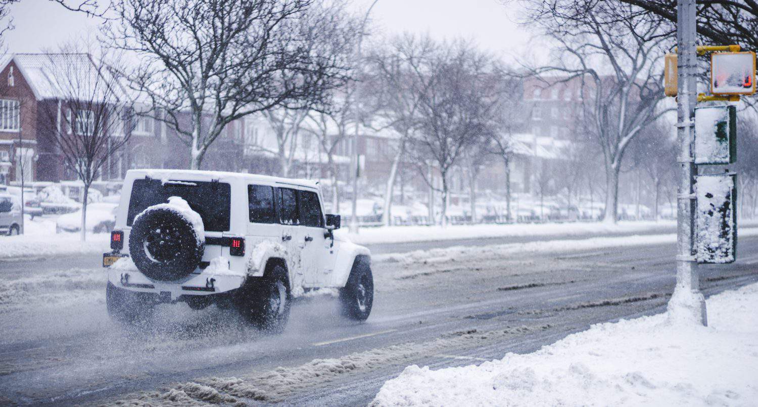 Jeep in Snowy Street.