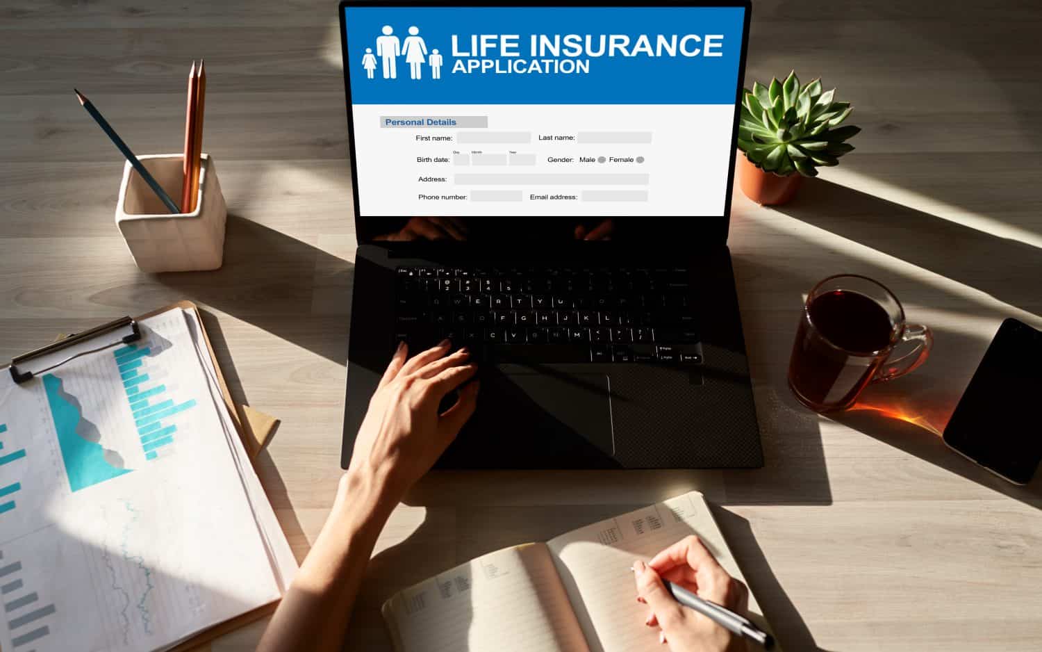 Life insurance online application form on device screen.