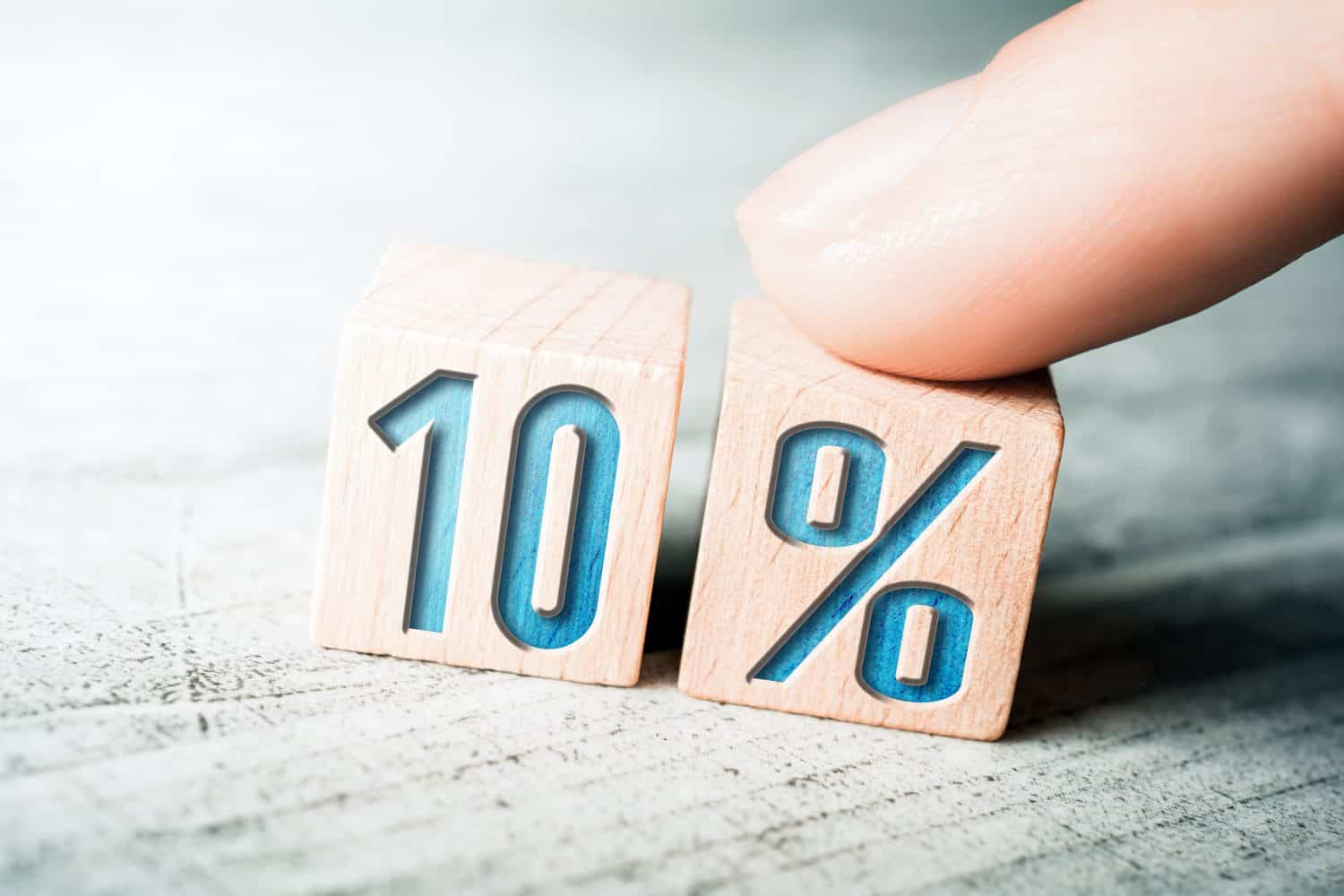 10 Percent Sale Discount Formed By Wooden Blocks And Arranged By A Female Finger On A Table