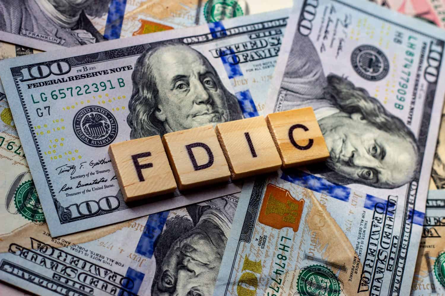 The word fdic on dollar usa background. USA Federal Deposit Insurance Corporation concept