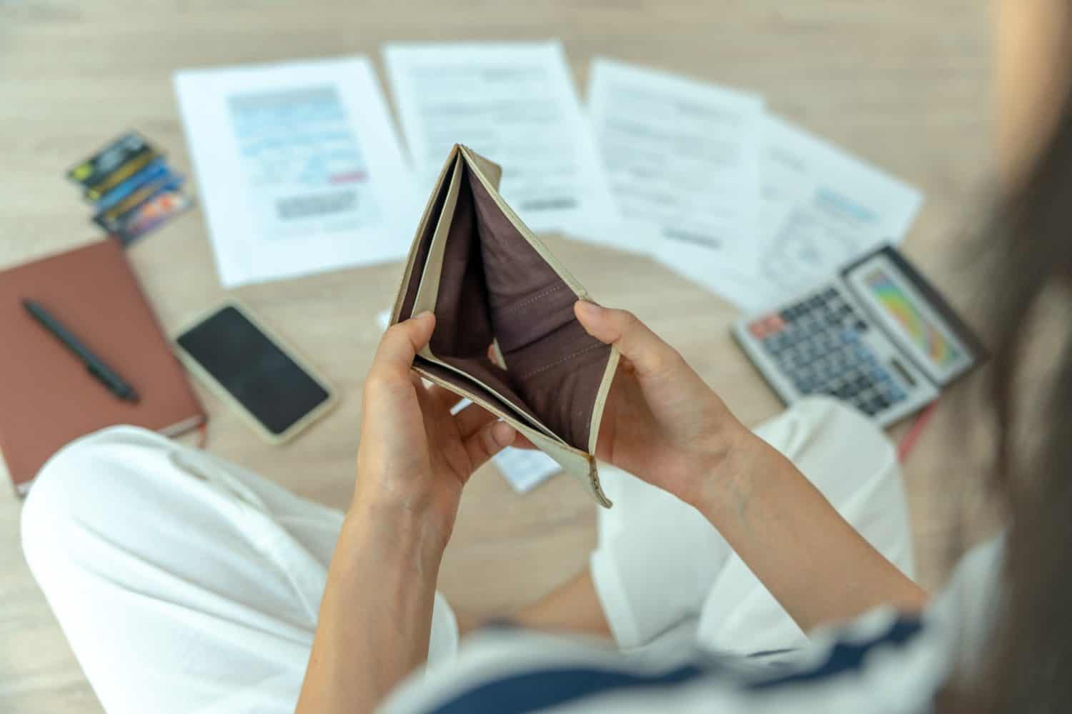 Women managing debt and expenses. People holding wallet but no money to pay credit card. broke, mortgage, loan, bankruptcy, bankrupt, can&#039;t to pay