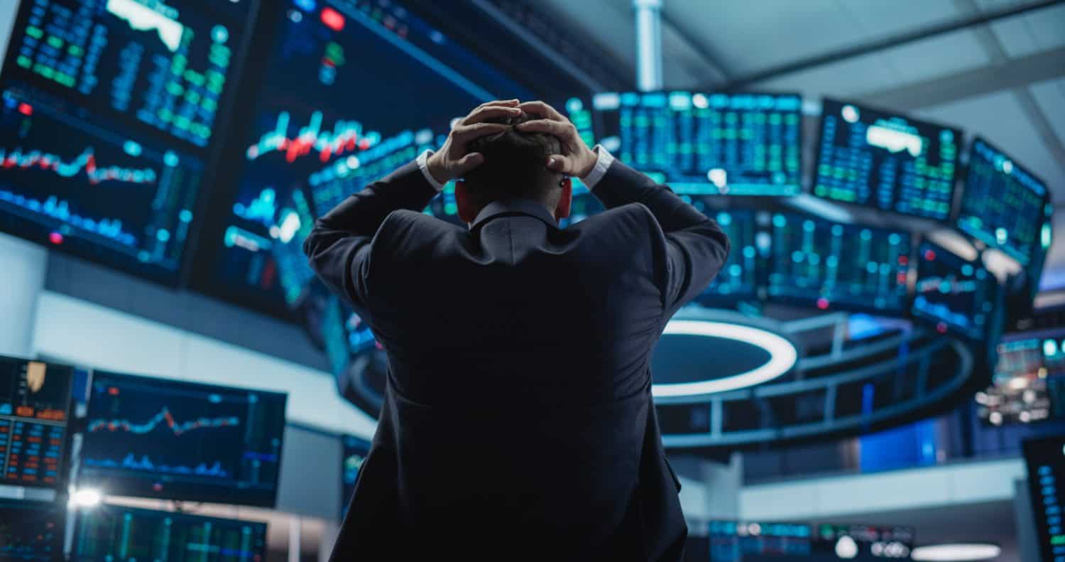 Stressed Stock Exchange Trader Can&#039;t Apprehend a Sudden Stock Market Collapse. Financial Crisis Concept with Stock Broker Saddened by Negative Ticker Information, Red Graphs and Real-Time Data