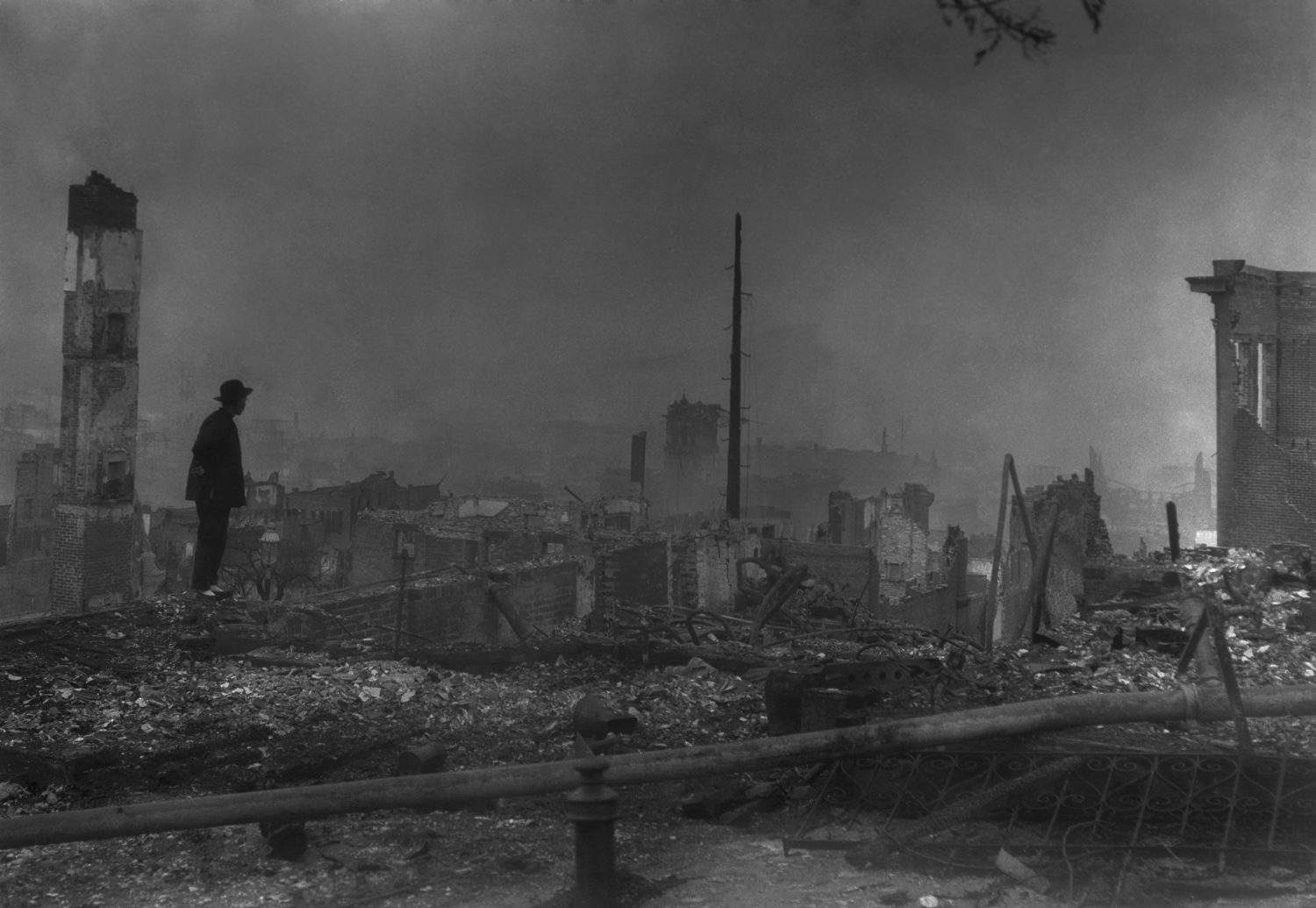 THE END OF OLD CHINATOWN, APRIL 23, 1906. By Arnold Genthe. Silhouette of a traditionally dressed Chinese-America against the ruins of San Francisco&#039;s Chinatown. April 1906 photo by Arnold Genthe.