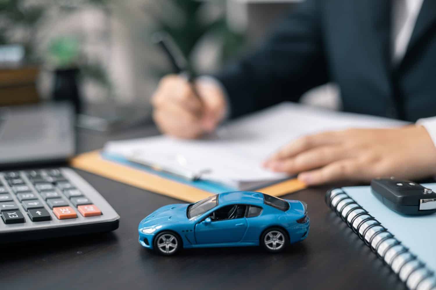 Dealership offered various finance options, including an auto loan or lease, making it easier to buy or rent a car from the company. Agent reviewed contract, finalizing insurance agreement.