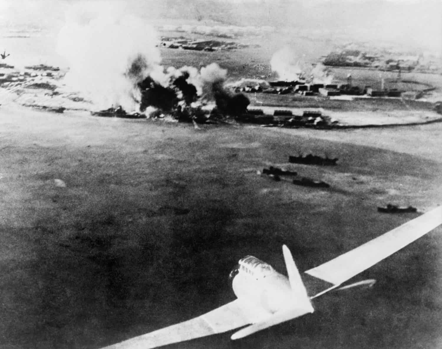 Photograph taken by a Japanese pilot, of the destruction of Pearl Harbor. At lower right is a Japanese bomber. Dec. 7, 1941.