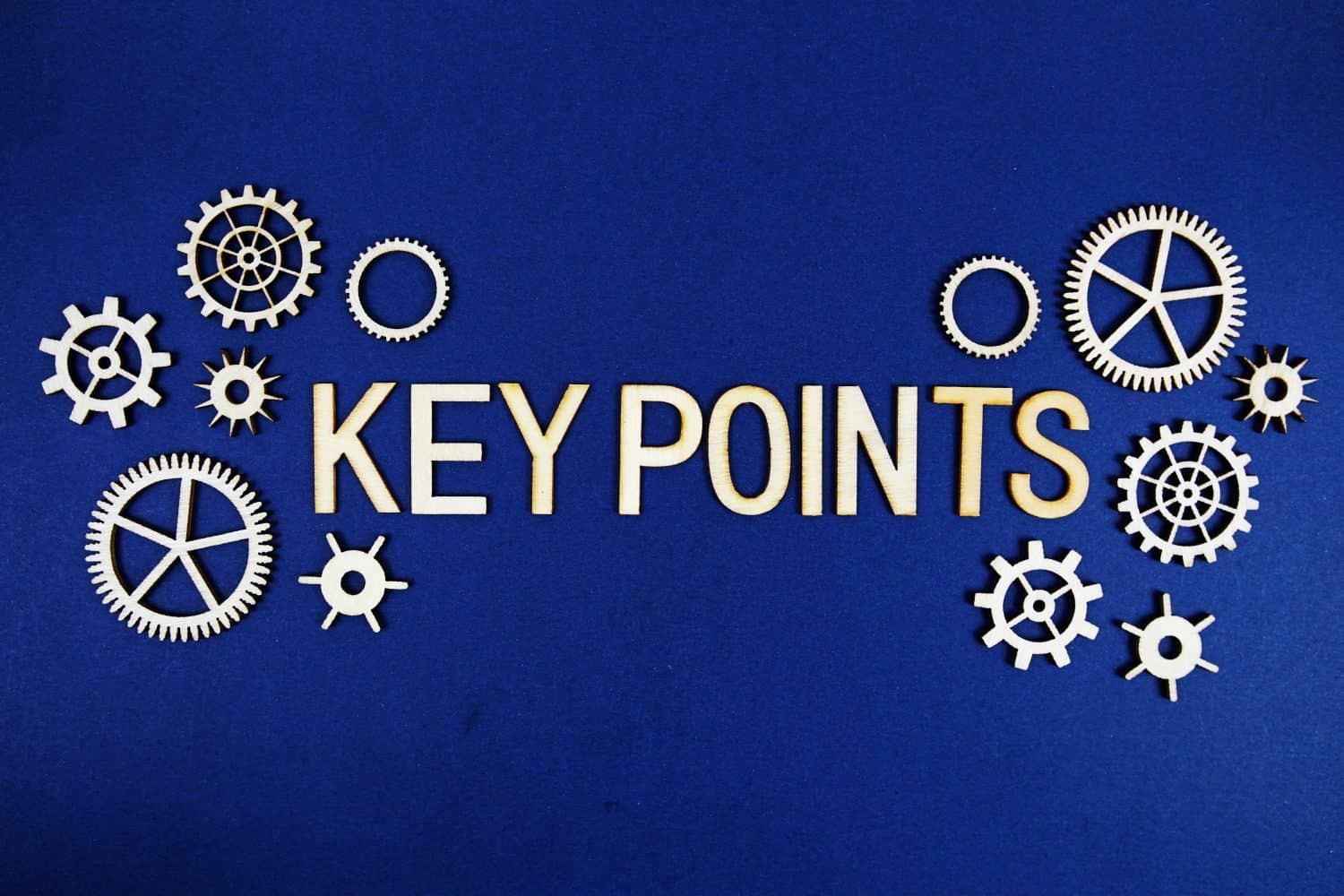 Key Point alphabet letters with gears element on navy blue background