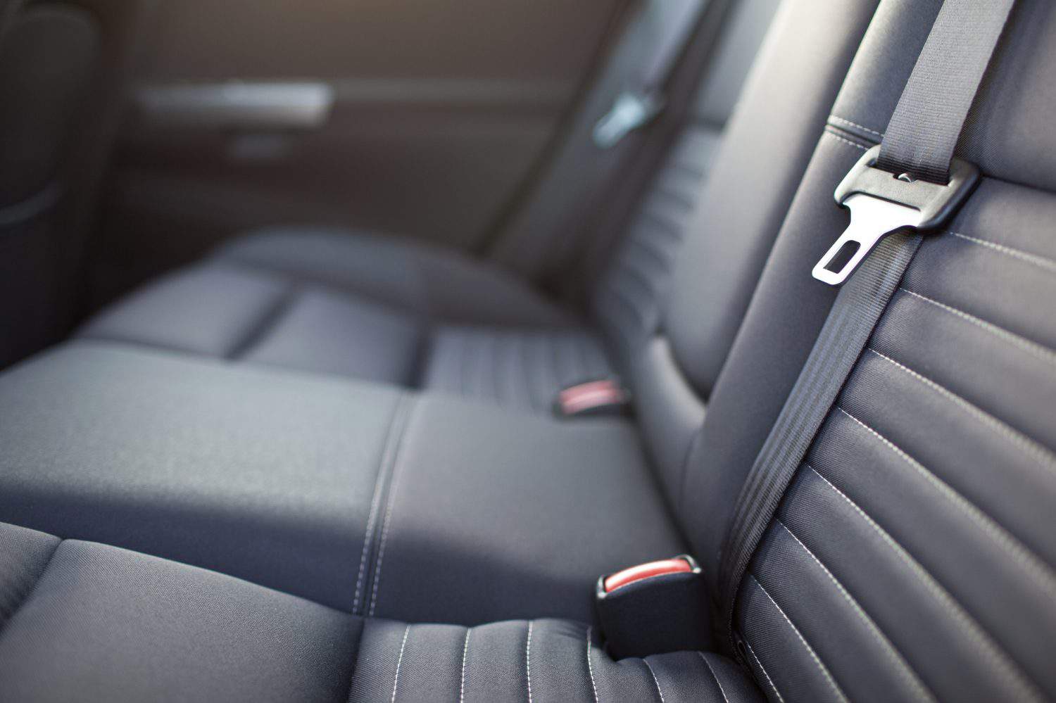 Modern car interior - rear seats with the seat belts