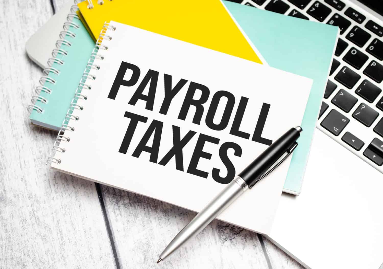 payroll taxes . Conceptual background with chart ,papers and pen