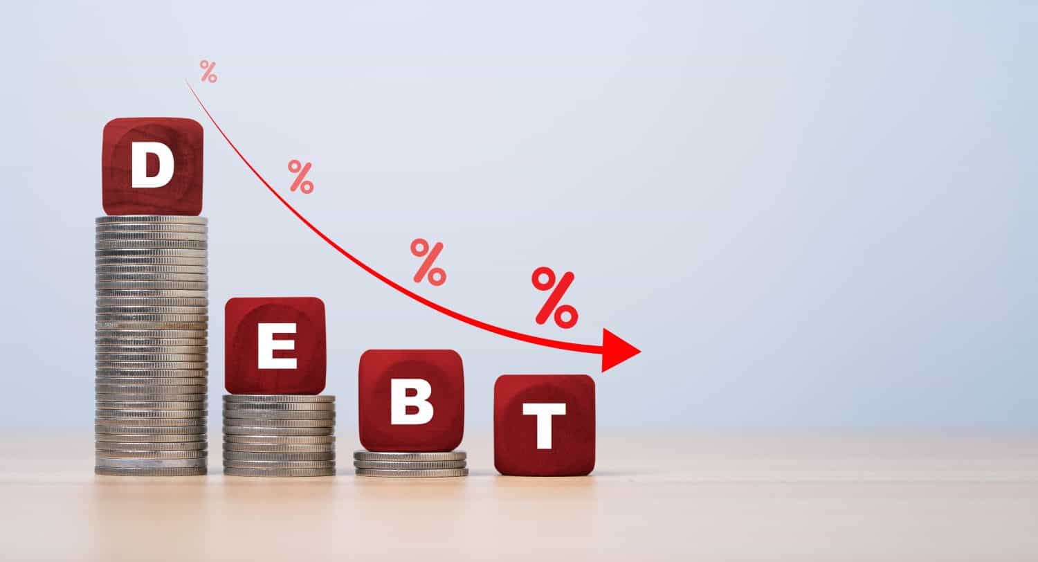 Debt wording on the top of decreasing coins stacking with down arrow and percentage for debt reducing concept.