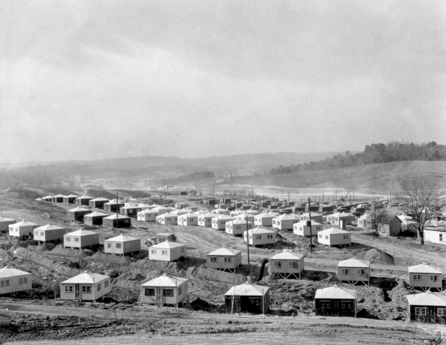 Small and simple homes under construction in Oak Ridge, Tennessee. Ca. 1945. They are for workers of the Manhattan Project's Clinton Engineering Works.