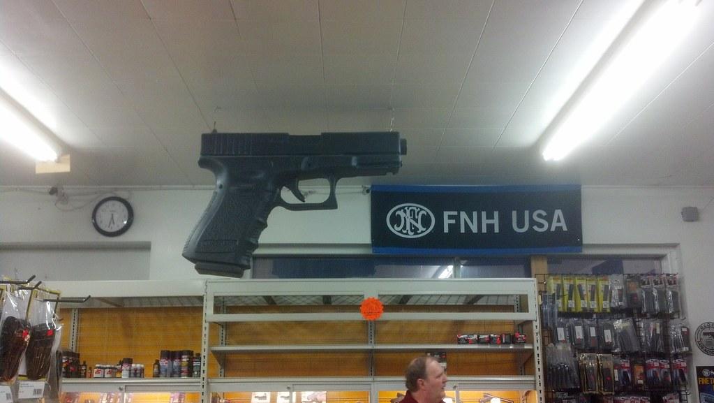 9-giant Glock at the gun store by tengrrl