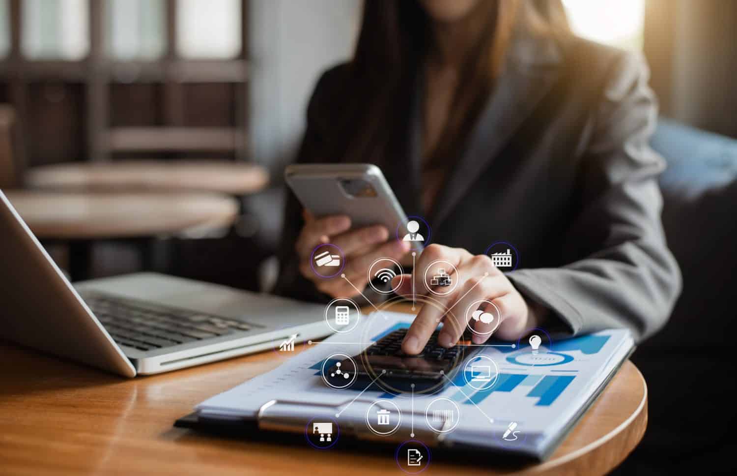 Analysts discuss business with a calculator as a tool.