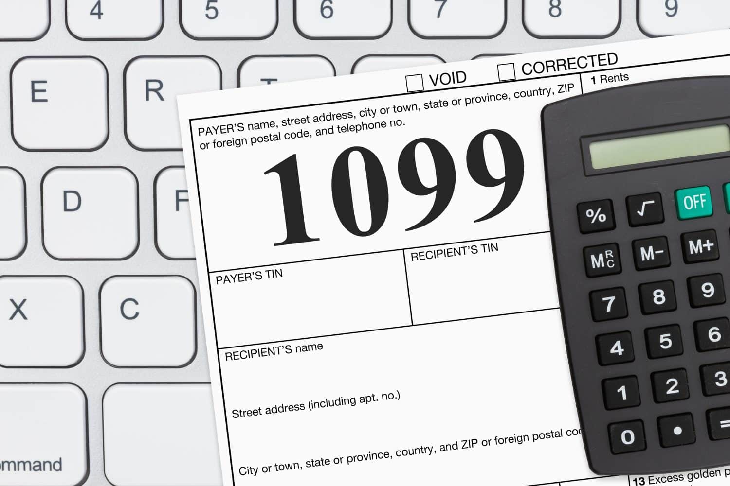 Doing your taxes as a freelancer with a USA 1099 form on a keyboard