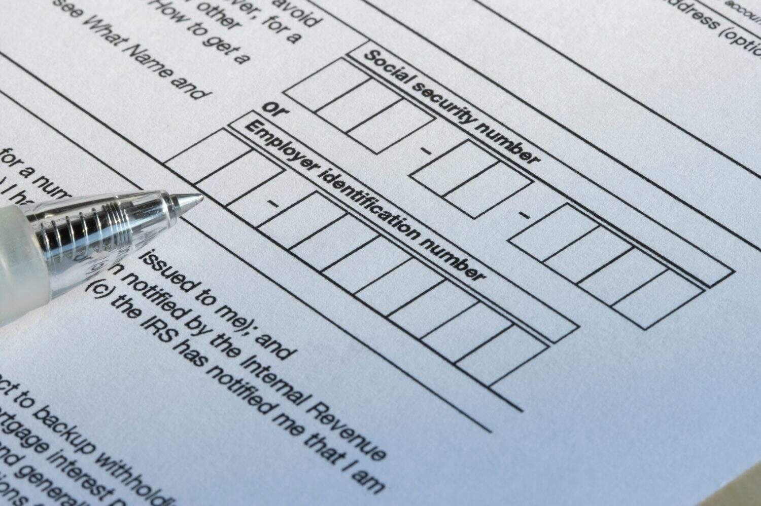 Closeup of the boxes for social security number (SSN) or employer identification number (EIN) on Form W-9, Request for Taxpayer Identification Number (TIN) and Certification.